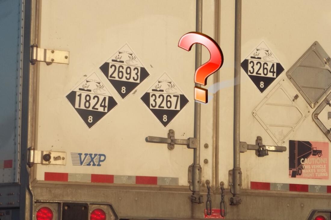 Multiple Class 8 placards on vehicle