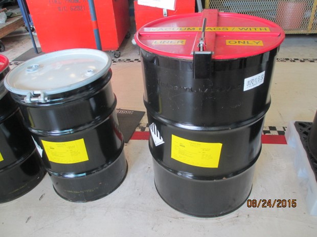 Two closed & labeled Haz Waste containers