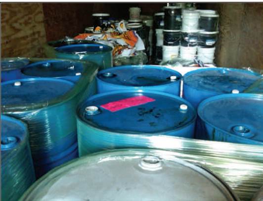 Photo of hazardous waste containers in a trailer